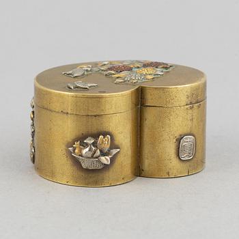 A lidded heart shaped brass box with cover, Meiji period (1868-1912), around the year 1900.