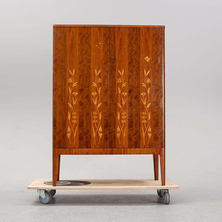 A 1940's Swedish Modern mahogany cabinet from Möbelbolaget.