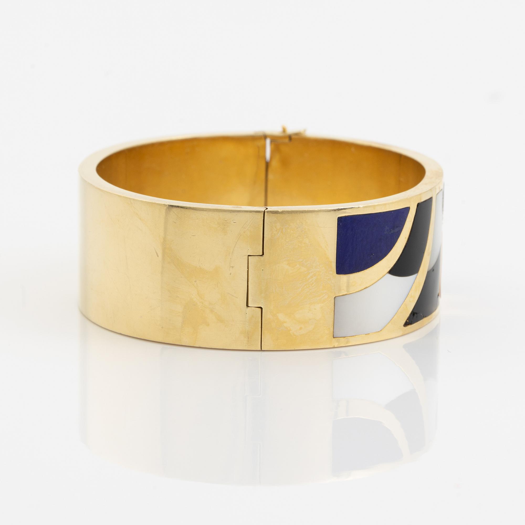 A Black Starr & Frost bracelet and a pair of earrings.
