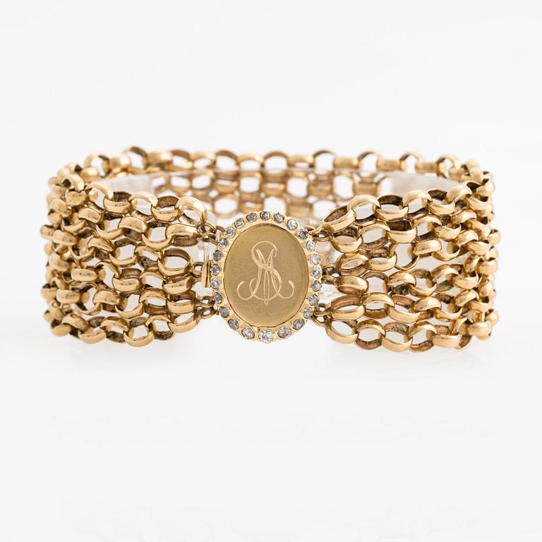 Bracelet, gold multi-strand pea links, monogram with frame of old-cut diamonds.