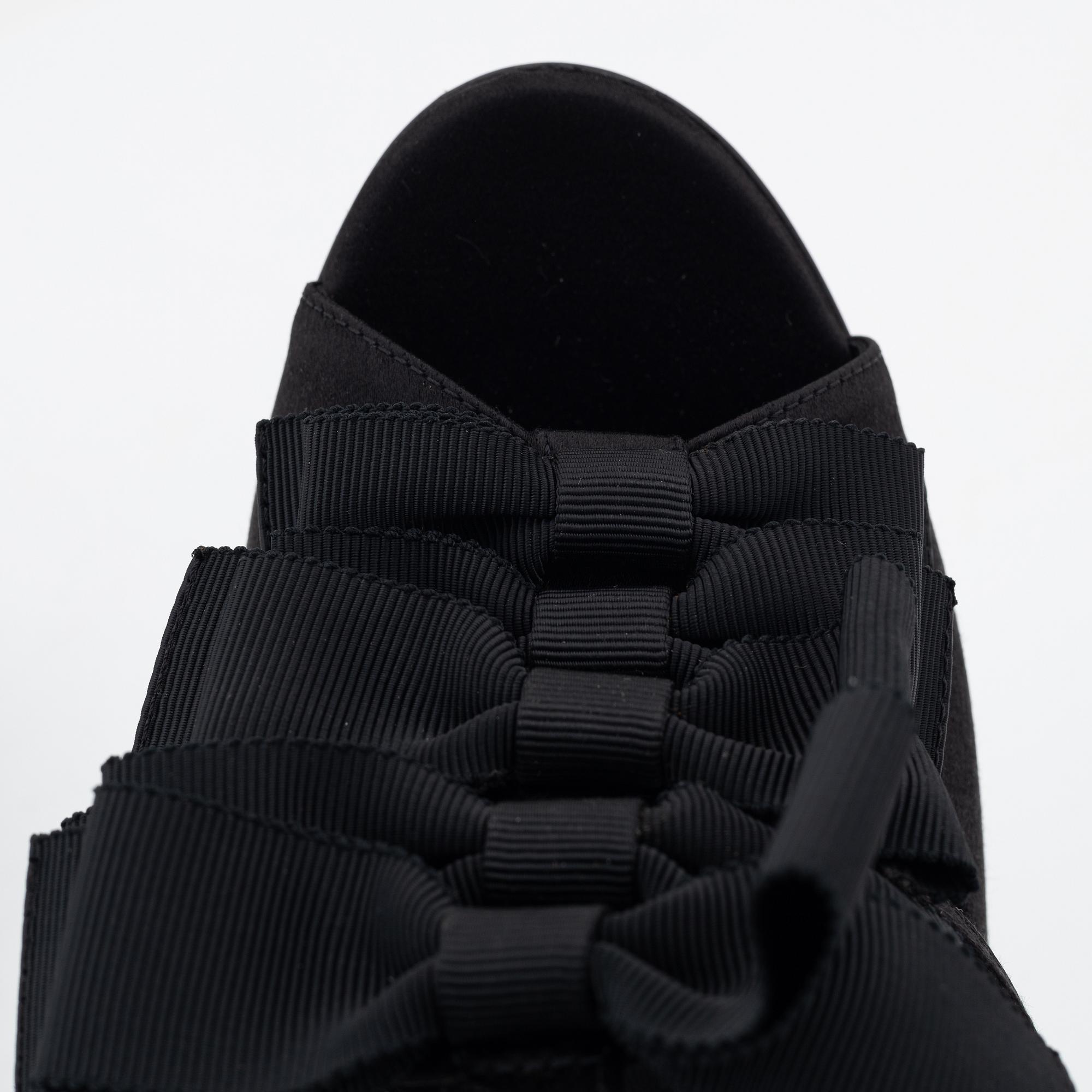 Yves Saint Laurent, a pair of black silk and bows platform sandals, size 37.