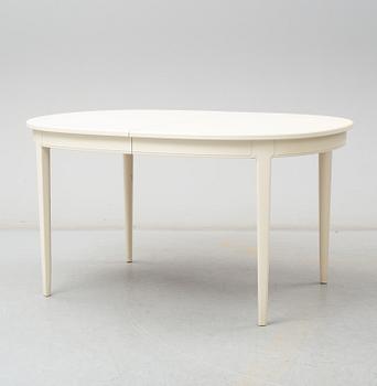 A dining table with four chairrs and two armchairs by Carl Malmsten from Åfors.