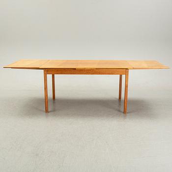 Knud Andersen, a set of six chairs for J.C.A Andersen, Aarhus, Denmark and a dinner table from Troeds, Bjärnum.