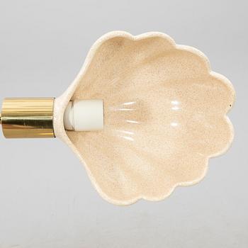 A late 20th Century floor lampp with a shell formed shade.