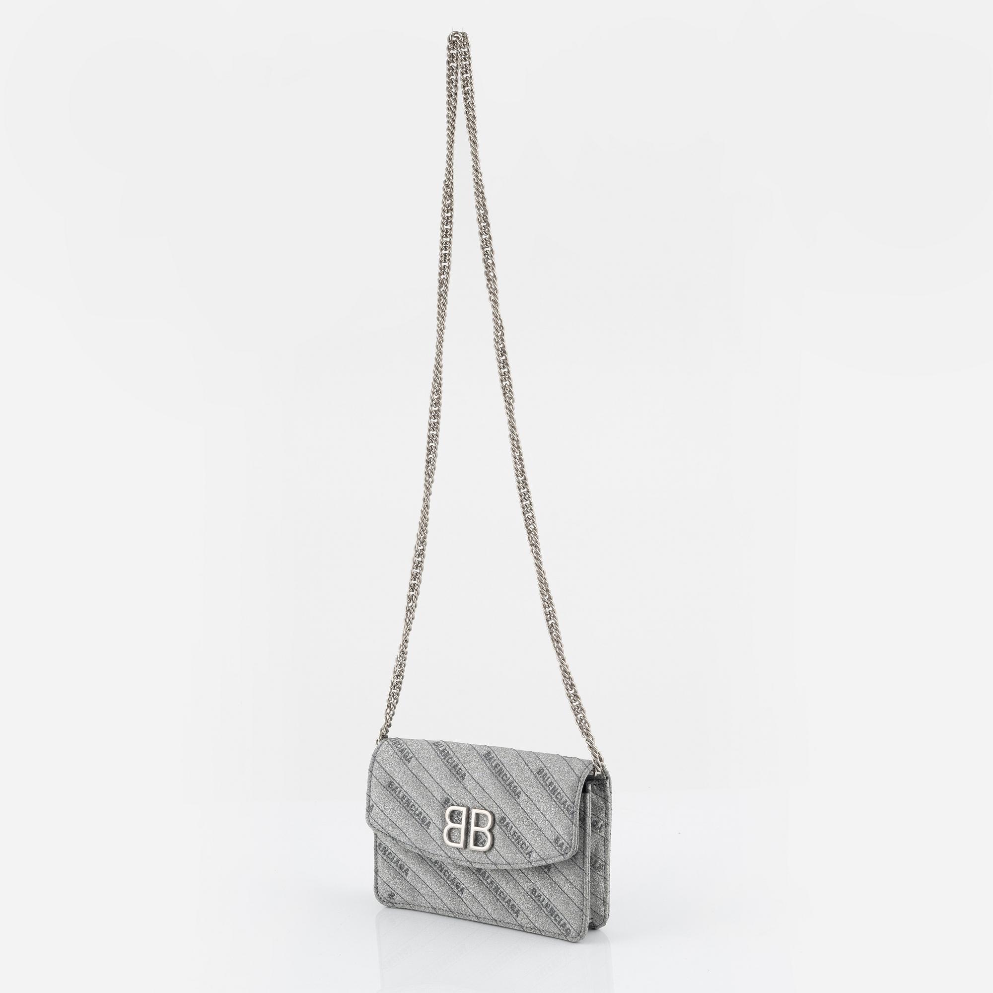Balenciaga, a 'BB Round glitter bag'.