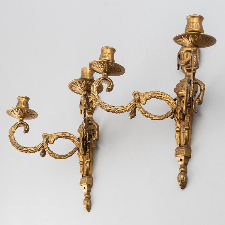 A 20th Century pair of Louis XVI style wall sconces, for two candles.