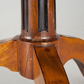 A 19th century drop-leaf table.