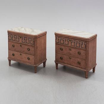 A pair of Gustavian style painted chest of drawers.