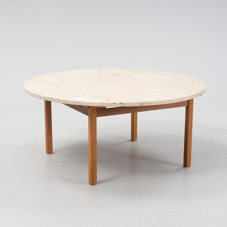 An oak coffee table with a later travertine top.