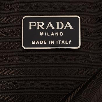 Prada, a tan suede bag.