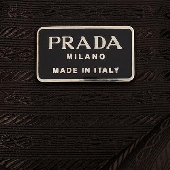 Prada, a tan suede bag.