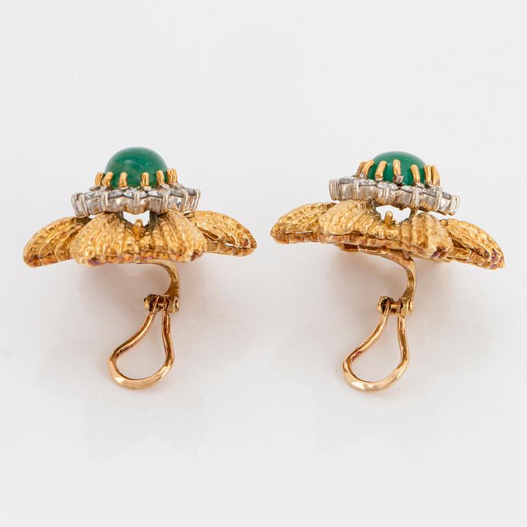 A pair of 18K gold earrings set with cabochon-cut emeralds and round brilliant-cut diamonds.