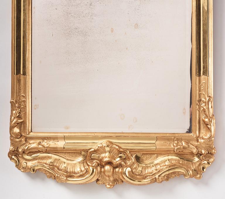 A Swedish rococo giltwood mirror, later part of the 18th century.