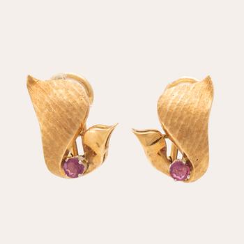 A pair of 18K gold earrings.