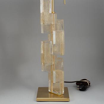 A 'Esha Alta' glass and brass table lamp from Donghia lightning.