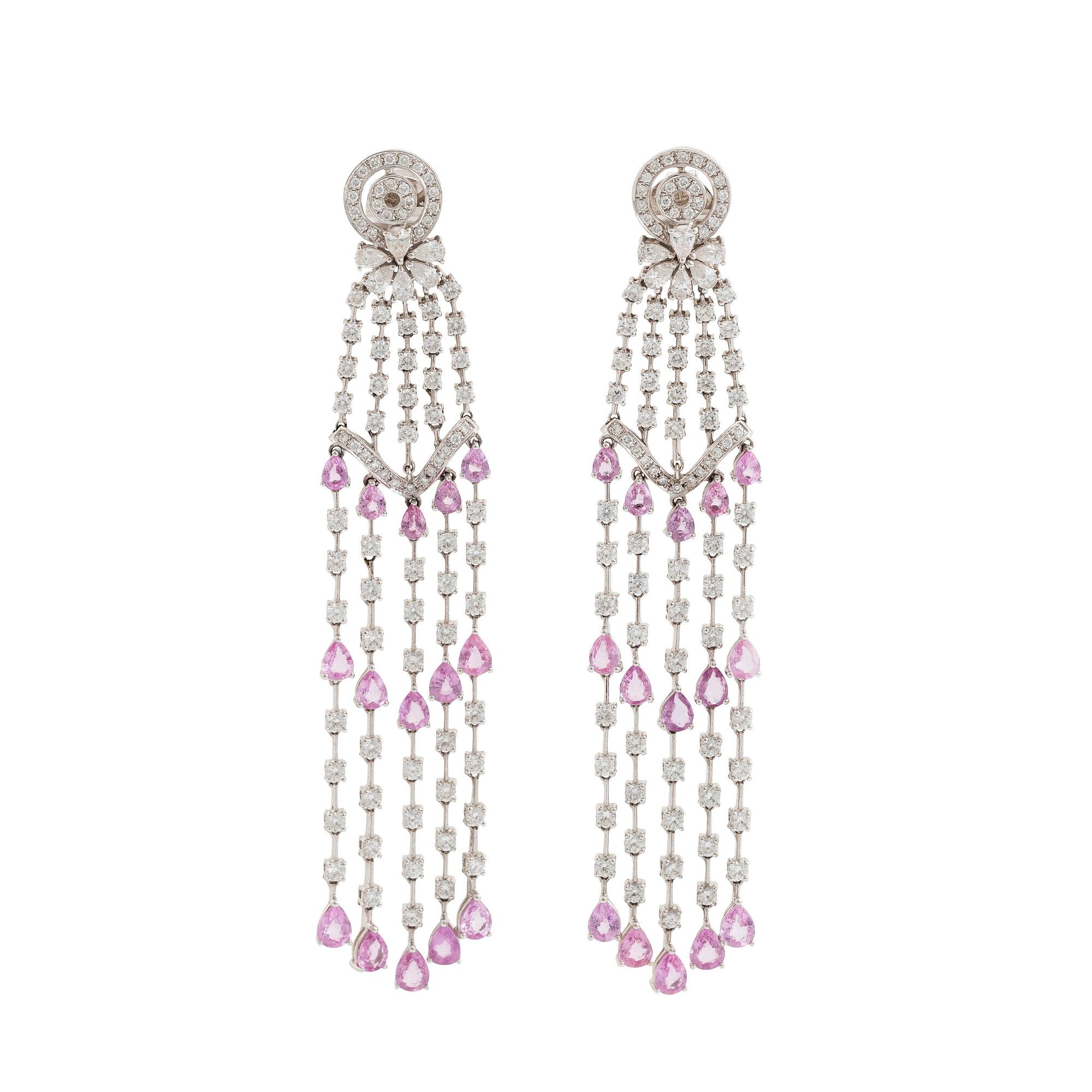 A pair of 18K white gold earrings set with faceted pink sapphires and round brilliant-cut diamonds.