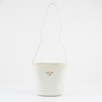 Prada, a white saffiano leather bag.