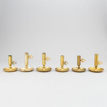 A set of six 19th-century brass candlesticks.