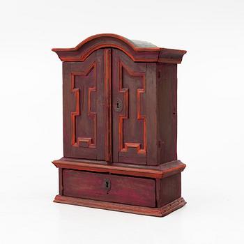 A 18th century Swedish wall-hanged cabinet.