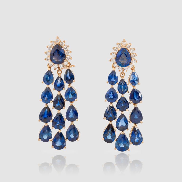 A pair of pear-shaped sapphire and brilliant-cut diamond earrings. Total carat weight circa 0.75 ct.