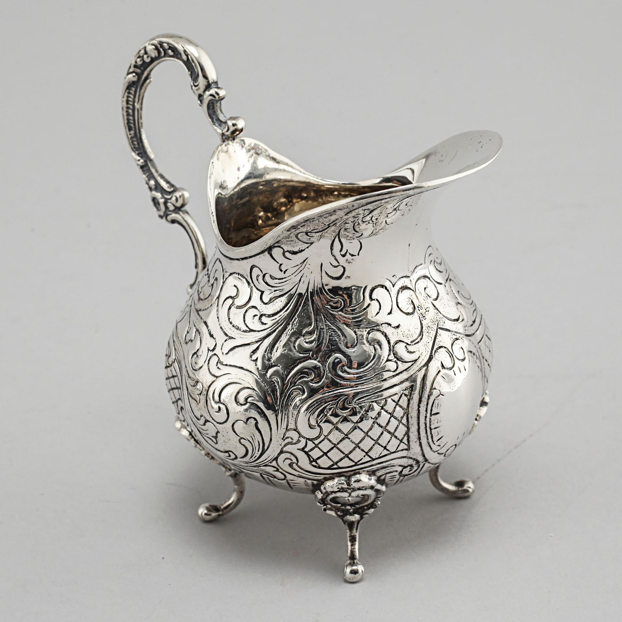 A silver sugarbowl, a cream jug and a tray by J L Hultman, Stockholm, mid 20th century.