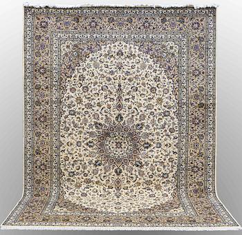A Keshan carpet, approx. 354 x 254 cm.