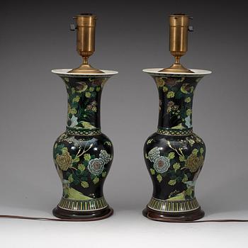 A pair of famille noir vases mounted as lamps, Qing dynasty, 19th Century.