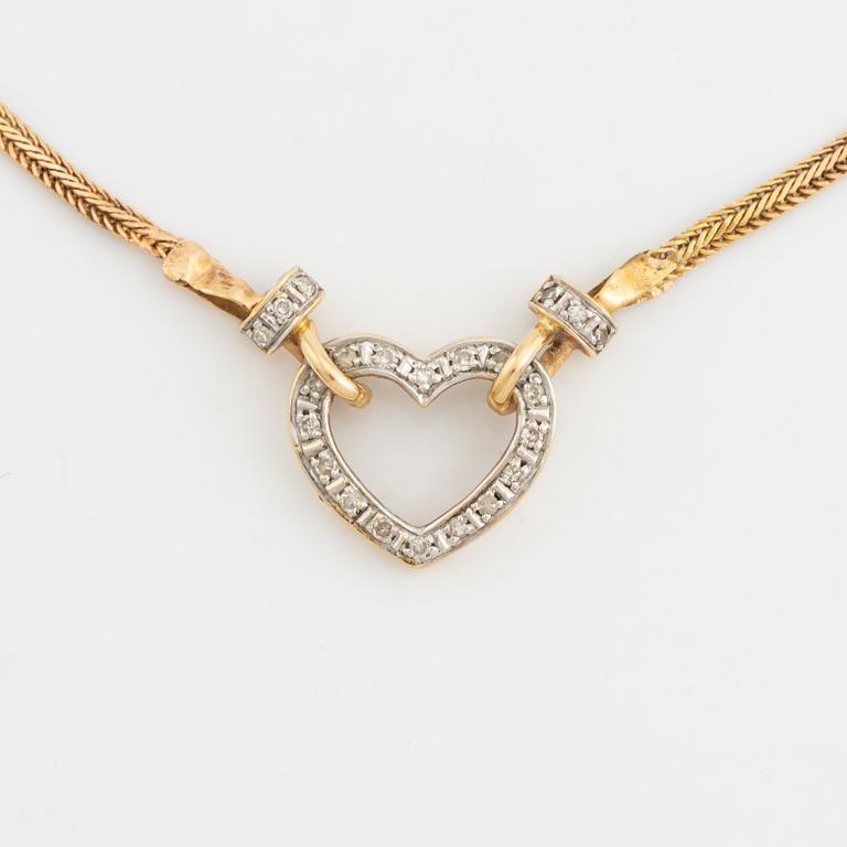 Gold and small diamond heart necklace.