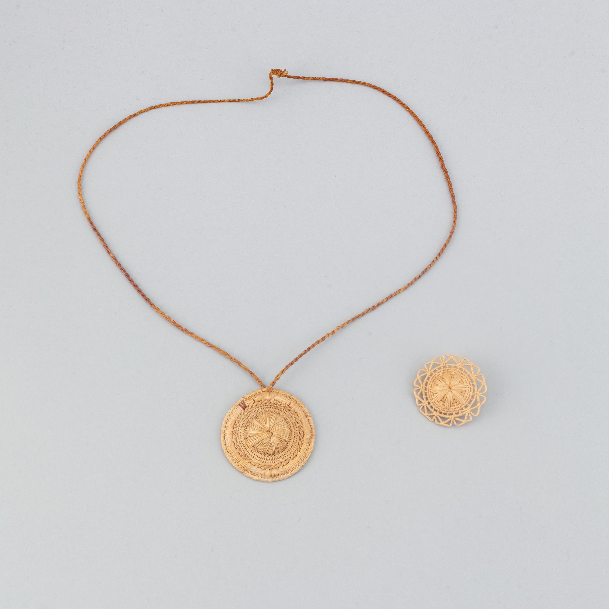 A Sami root brooch and pendant.