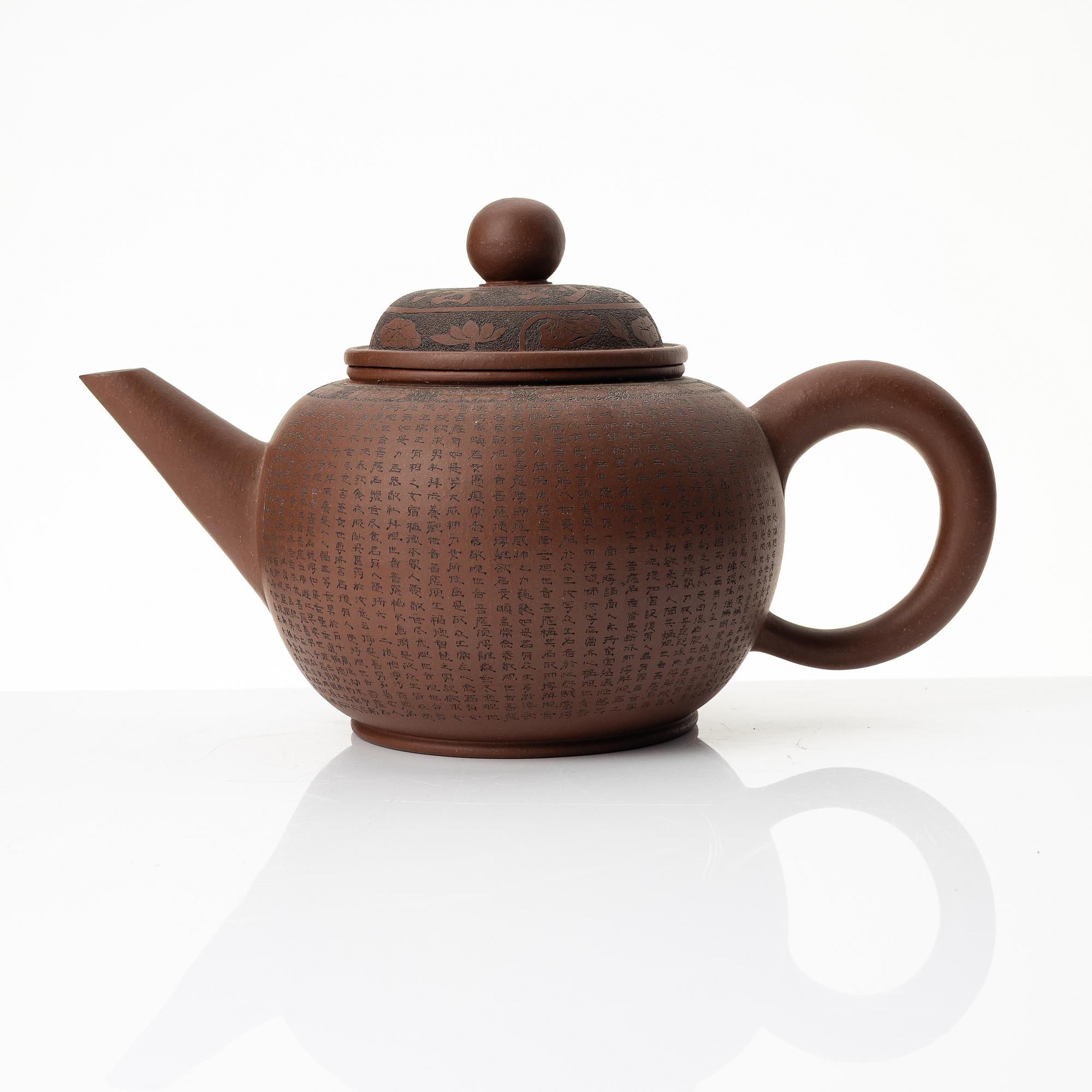 A 'calligraphy' yixing teapot, China, later part of the 1900s.