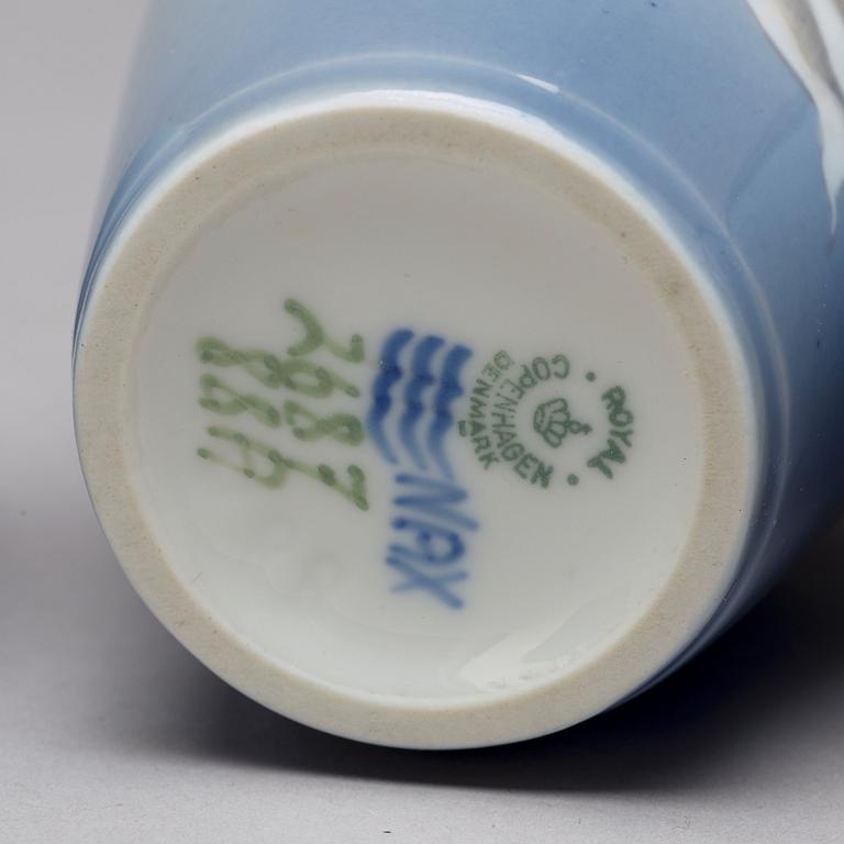 BING & GRÖNDAHL and ROYAL COPENHAGEN, a set of three porcelain vases and a dish, Denmark.