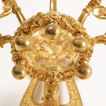 A pair of French 19th century gilt bronze five-light wall-lights.