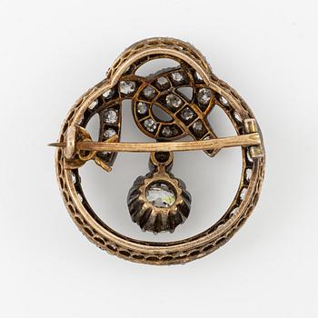 A brooch, silver and gold set with old-cut diamonds.