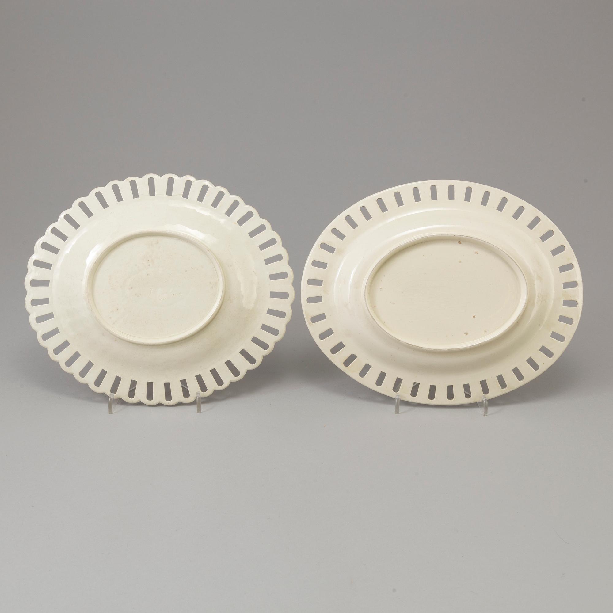 A CREAMWARE BASKET, PLATE AND A SIMILAR PLATE, one marked Wedgwood, first half of the 19th century.