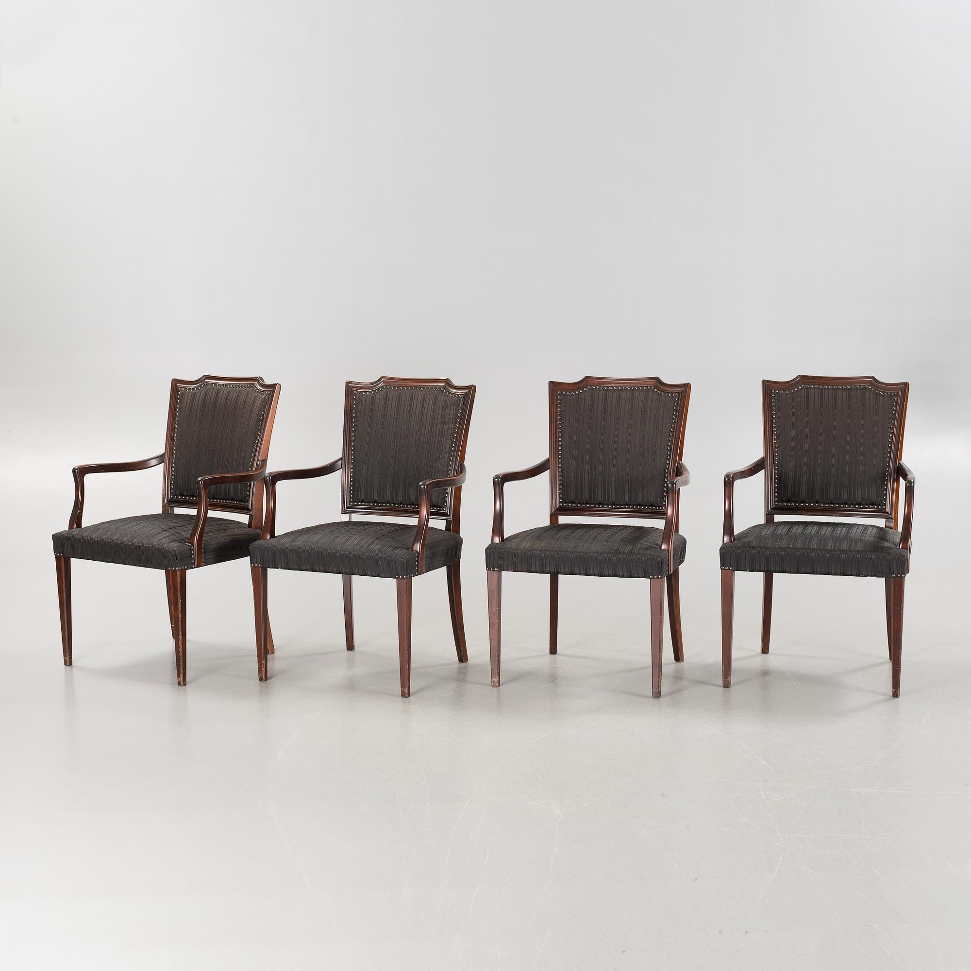 An english style dining table and eight chairs, second half of the 20th century.