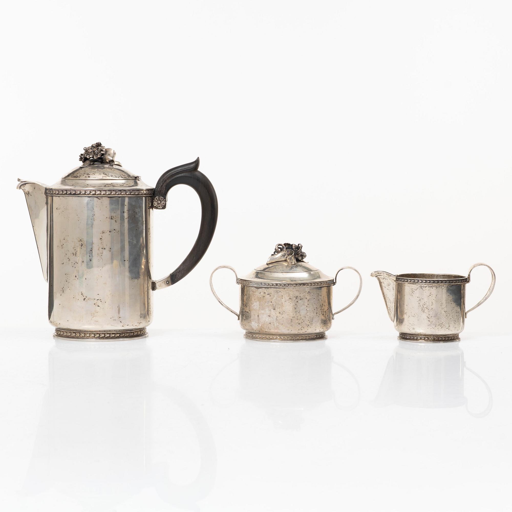 A Swedish silver coffee pot, cream jug and sugar bowl, mark of Caneman & Wallen, Stockholm 1949.