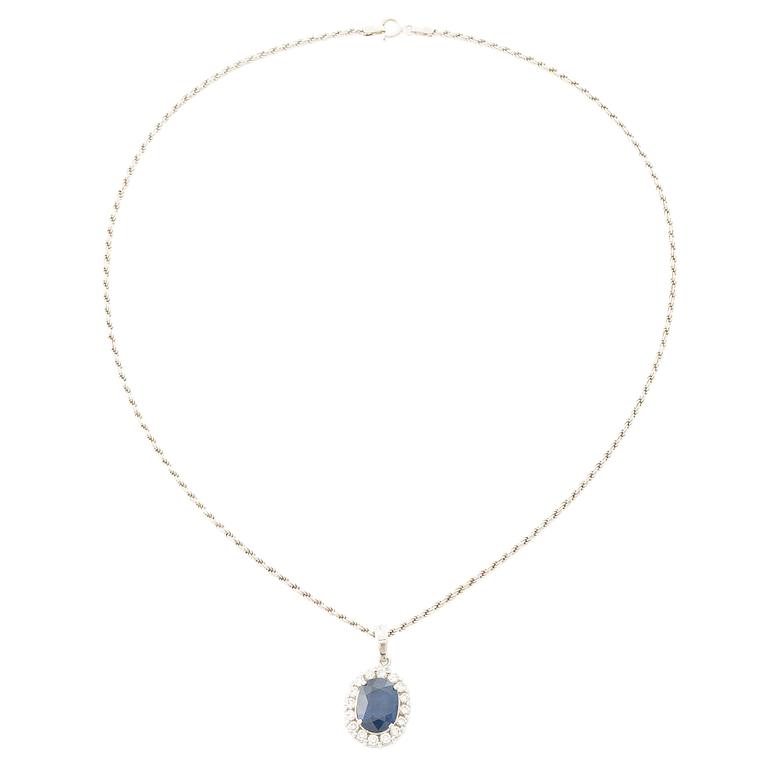 Pendant in 18K white gold with a faceted sapphire and round brilliant-cut diamonds.