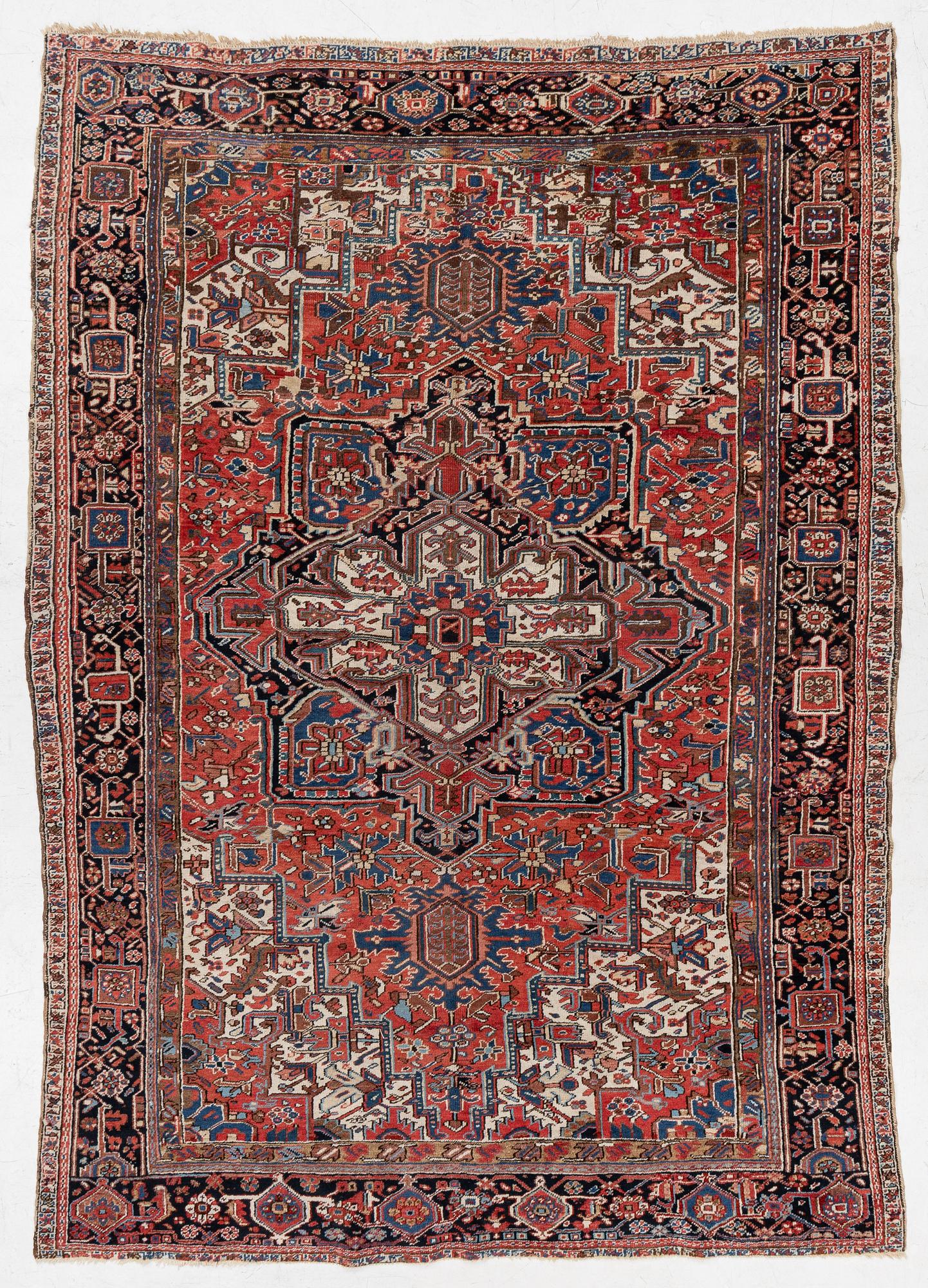An antique Heriz carpet, west Persia, c. 333 x 238 cm.