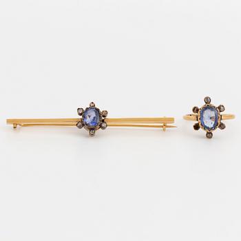 An 18K gold brooch and ring set with oval, mixed-cut sapphires and rose-cut diamonds.
