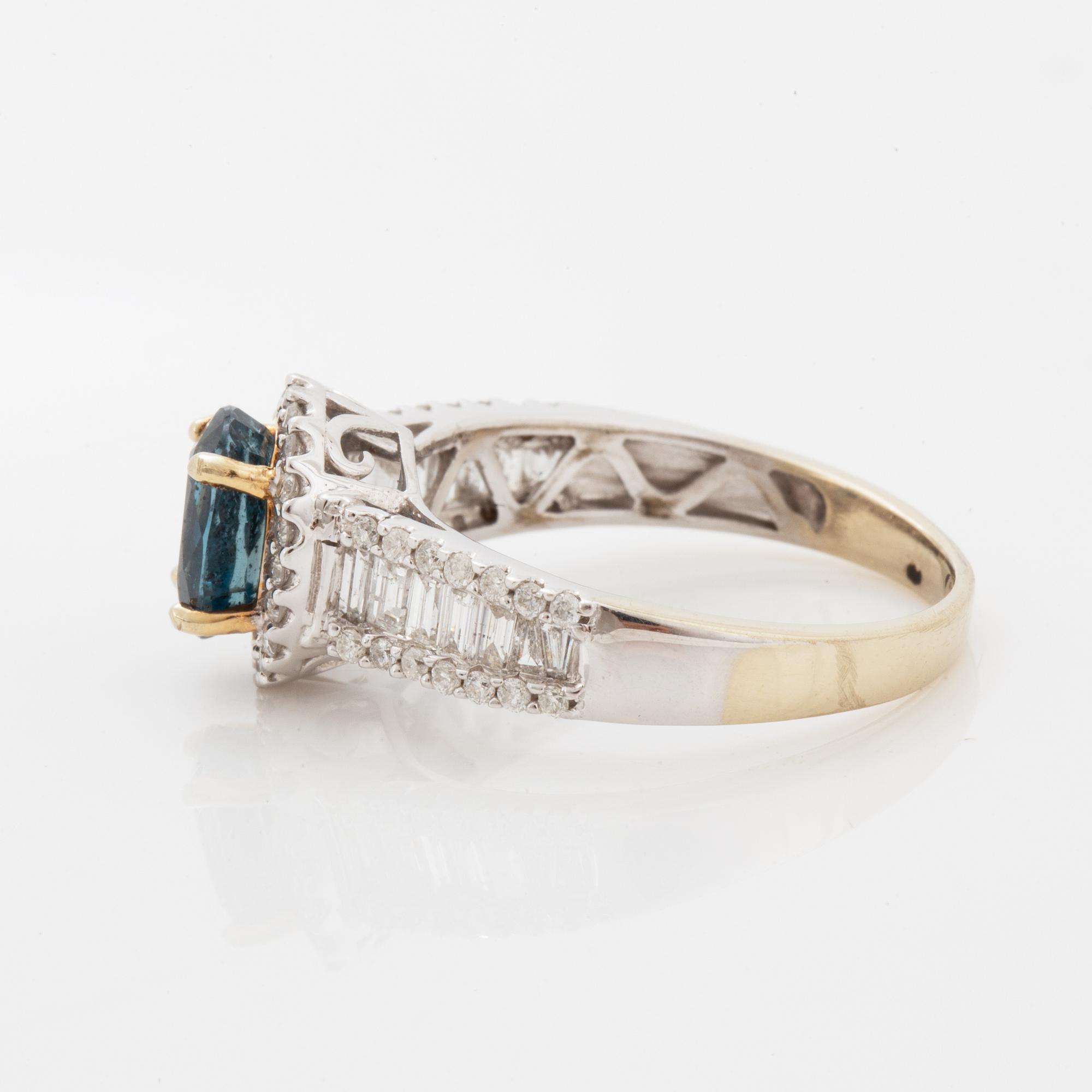 Oval faceted kyanite and diamond ring.