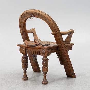 Armchair, after a design by Vasily Shutov called 'Arc, Axes and Mittens' Russia late 19th century.