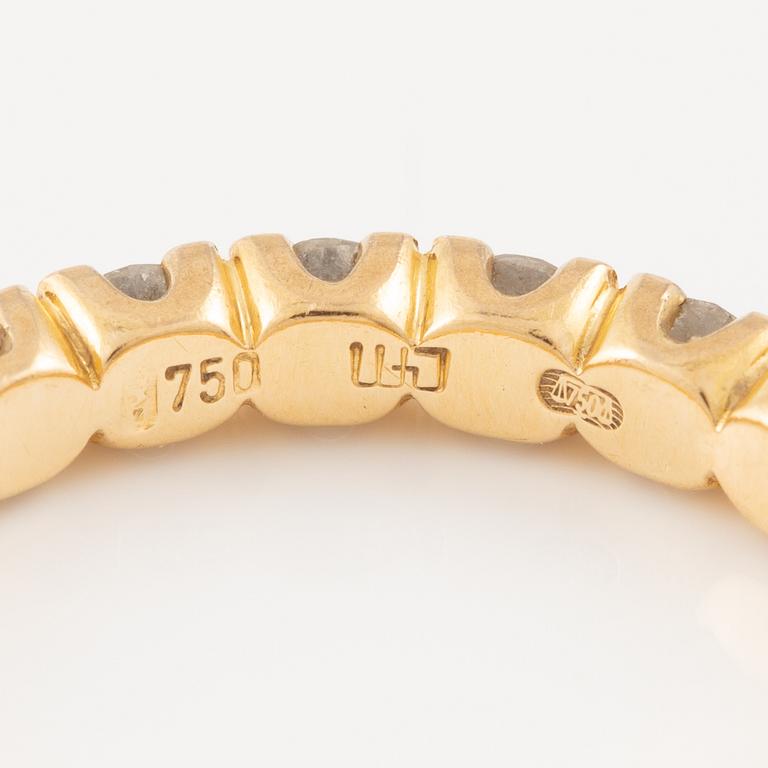 Ring in 18K gold set with round brilliant-cut diamonds, eternity band.