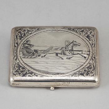 A Russian parcel-gilt silver and niello cigarette-case, import marks 1882-98.