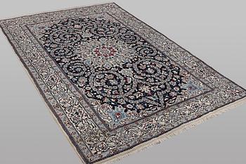 A carpet, Nain, part silk, 9 Laa, ca 295 x 197 cm.