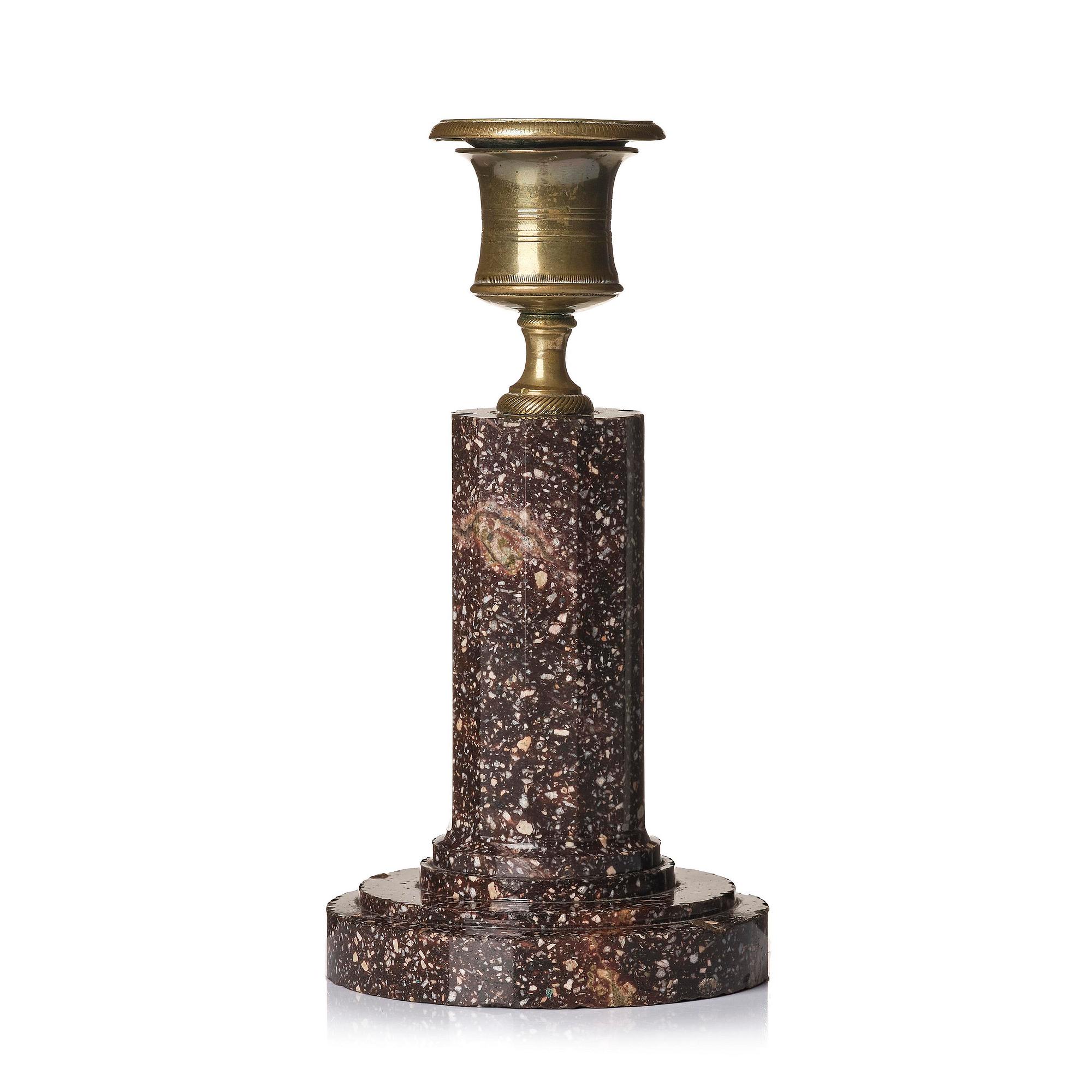 An Empire 'Blyberg' porphyry candlestick from Älvdalen, first part 19th century.