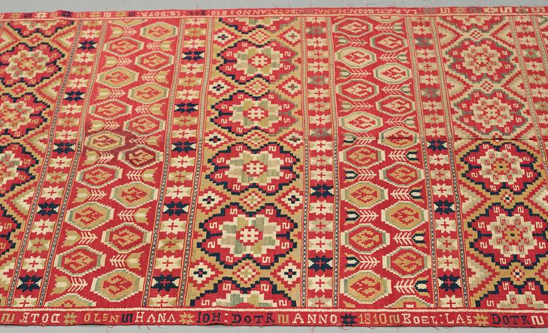 A BED COVER, double-interlocked tapestry, ca 197 x 117,5 cm, Scania (Skåne)1810, probably Gärds or Villands district.