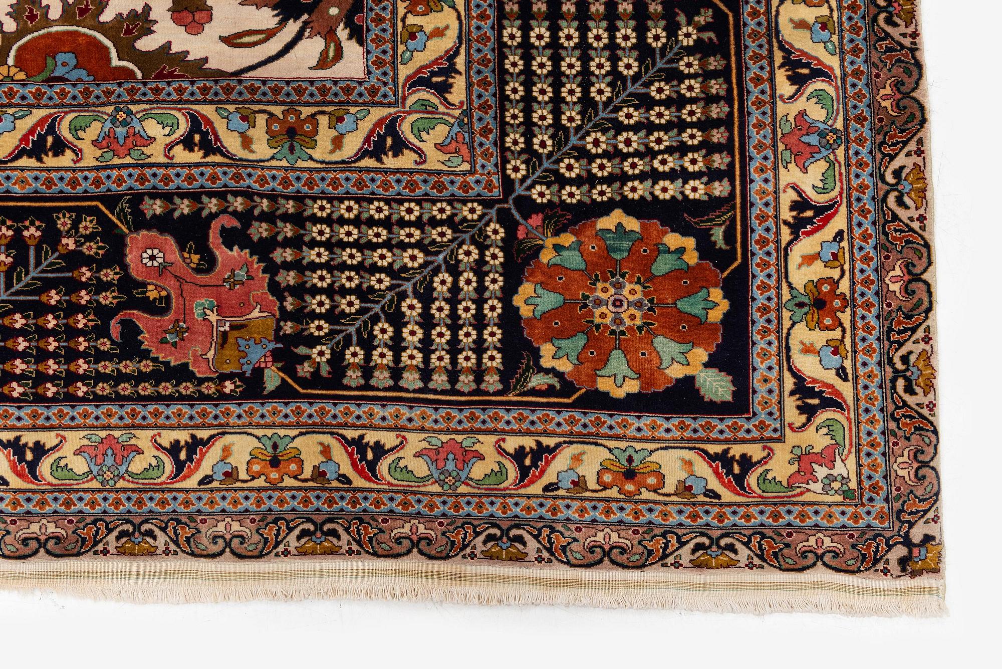 A semi-antique Tabriz carpet, Northwest Persia, of Safavid 'Vase' design, c.328 x 242 cm.