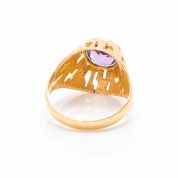 A set of 14K gold earrings and a ring with amethysts.