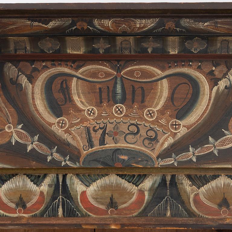 A painted cabinet, dated 1788.