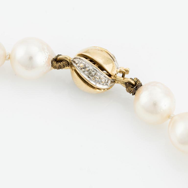 Necklace & bracelet, cultured pearls with 18K gold clasp and small diamonds.